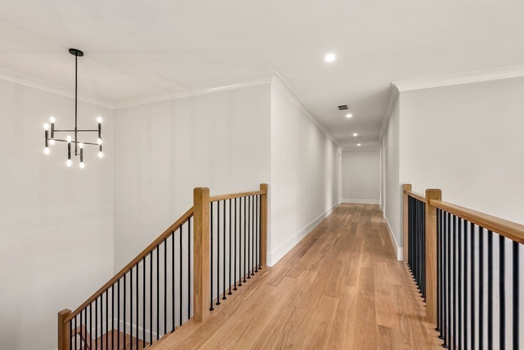 21 Beechnut Road Westwood, MA 02090 - Photo 19 of 41 a view of a hallway with wooden floor and stairs
