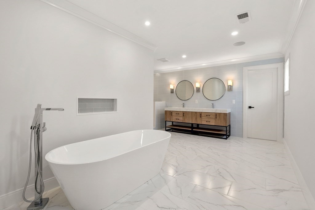 21 Beechnut Road Westwood, MA 02090 - Photo 22 of 41 a view of a room with cabinet mirror and windows