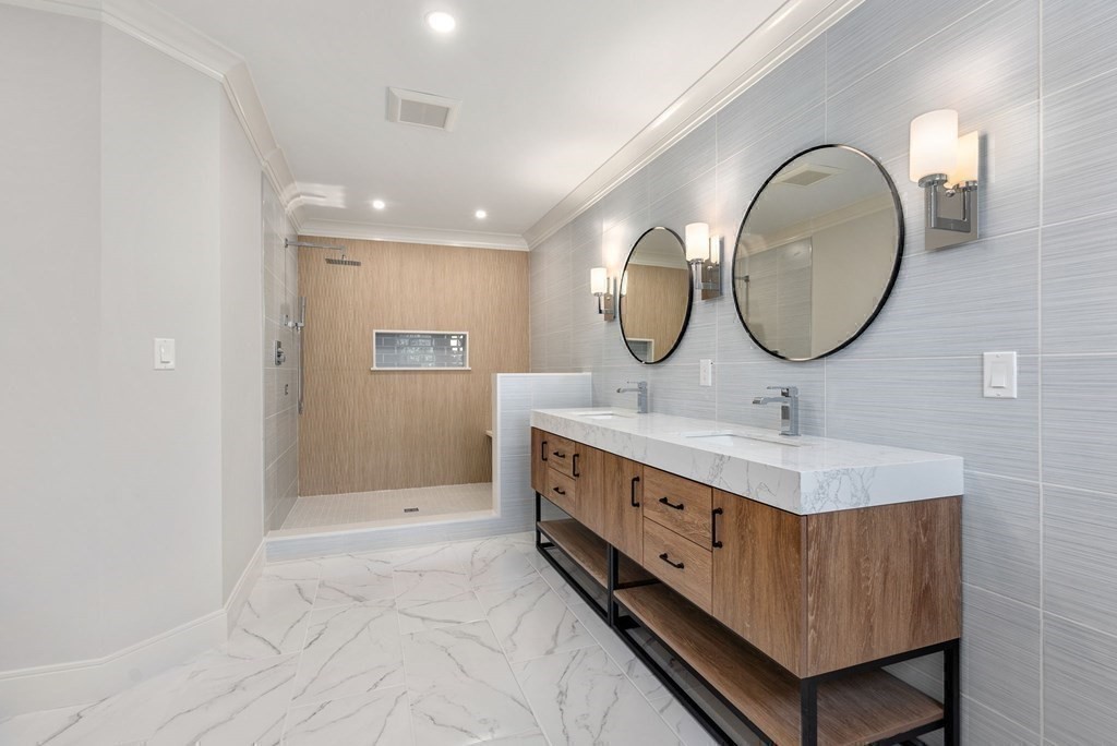 21 Beechnut Road Westwood, MA 02090 - Photo 23 of 41 a bathroom with a double vanity sink and mirror