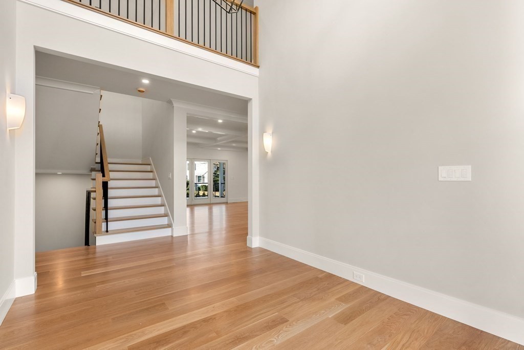 21 Beechnut Road Westwood, MA 02090 - Photo 3 of 41 a view of a hallway with wooden floor and staircase
