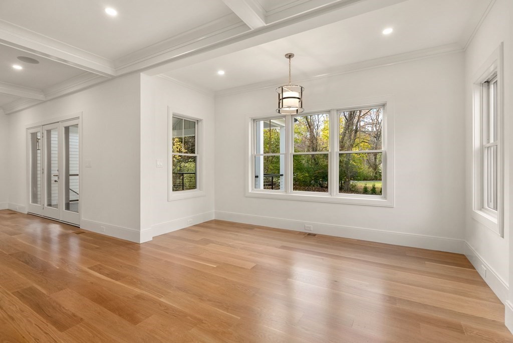 21 Beechnut Road Westwood, MA 02090 - Photo 9 of 41 a view of an empty room with wooden floor and a window