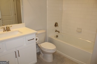 1958 Lola Lane Southwest Marietta, GA 30064 - Photo 13 of 42 a bathroom with a sink a toilet and shower