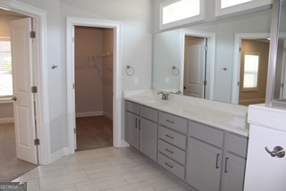 1958 Lola Lane Southwest Marietta, GA 30064 - Photo 23 of 42 a bathroom with a double vanity sink a and mirror