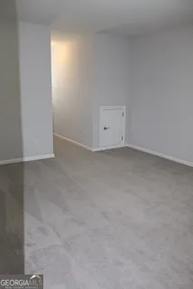 a view of an empty room and entryway