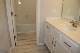 a bathroom with a sink and a shower