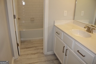 1958 Lola Lane Southwest Marietta, GA 30064 - Photo 33 of 42 a bathroom with a sink and a shower
