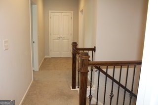 1958 Lola Lane Southwest Marietta, GA 30064 - Photo 35 of 42 a view of a hallway with wooden floor and staircase