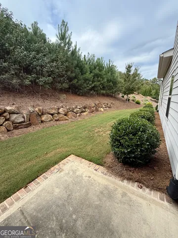 a view of a lake with a yard