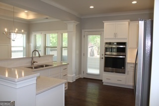 1958 Lola Lane Southwest Marietta, GA 30064 - Photo 8 of 42 a kitchen with stainless steel appliances granite countertop a stove and a refrigerator