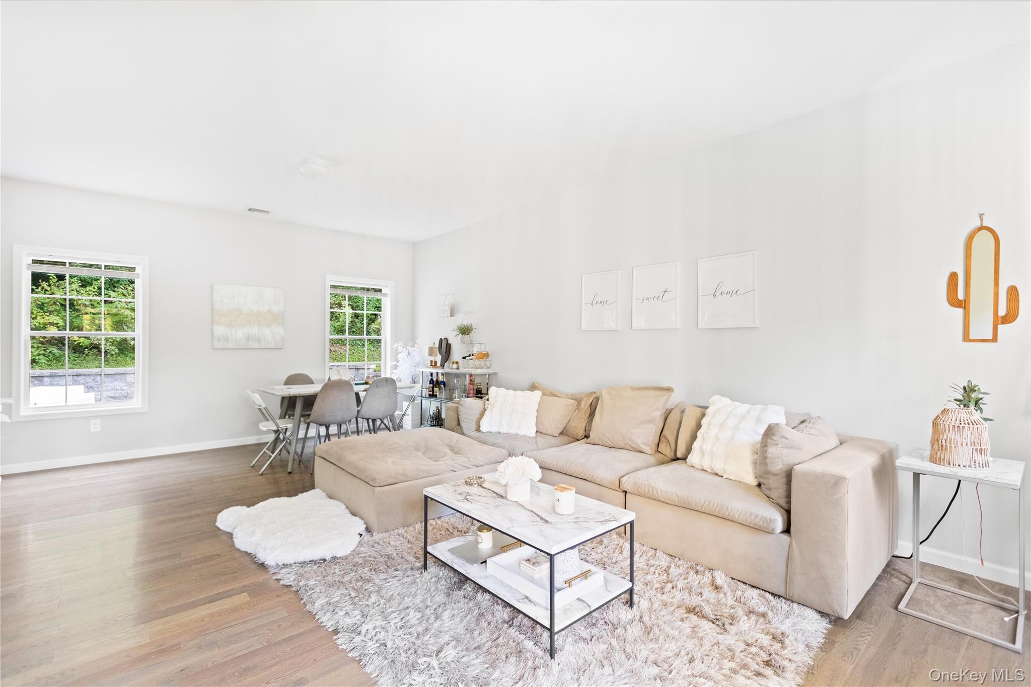 24 Belmont Road Sound Beach, NY 11789 - Photo 9 of 23 a living room with furniture and wooden floor