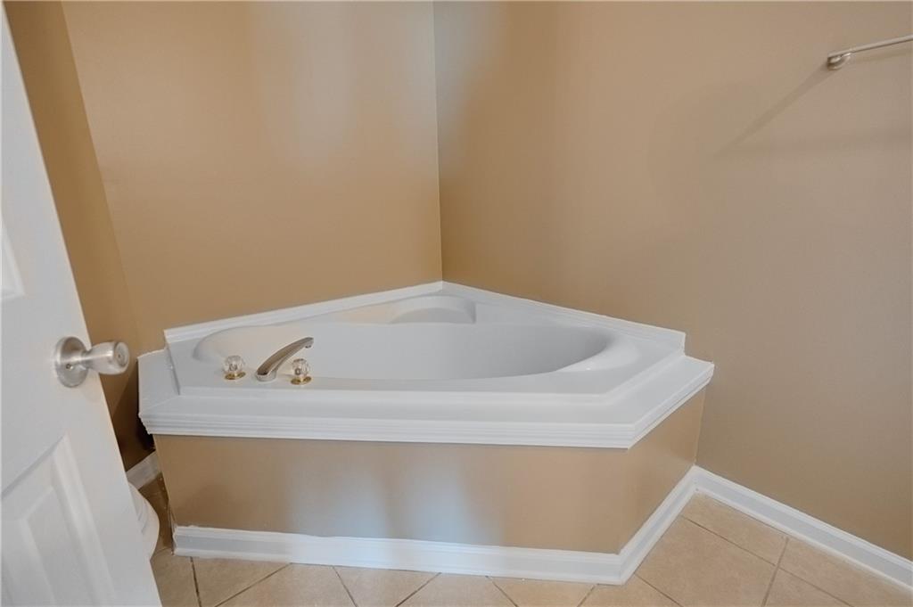 4203 Legacy Square Atlanta, GA 30349 - Photo 29 of 35 a bath tub sitting in a bathroom