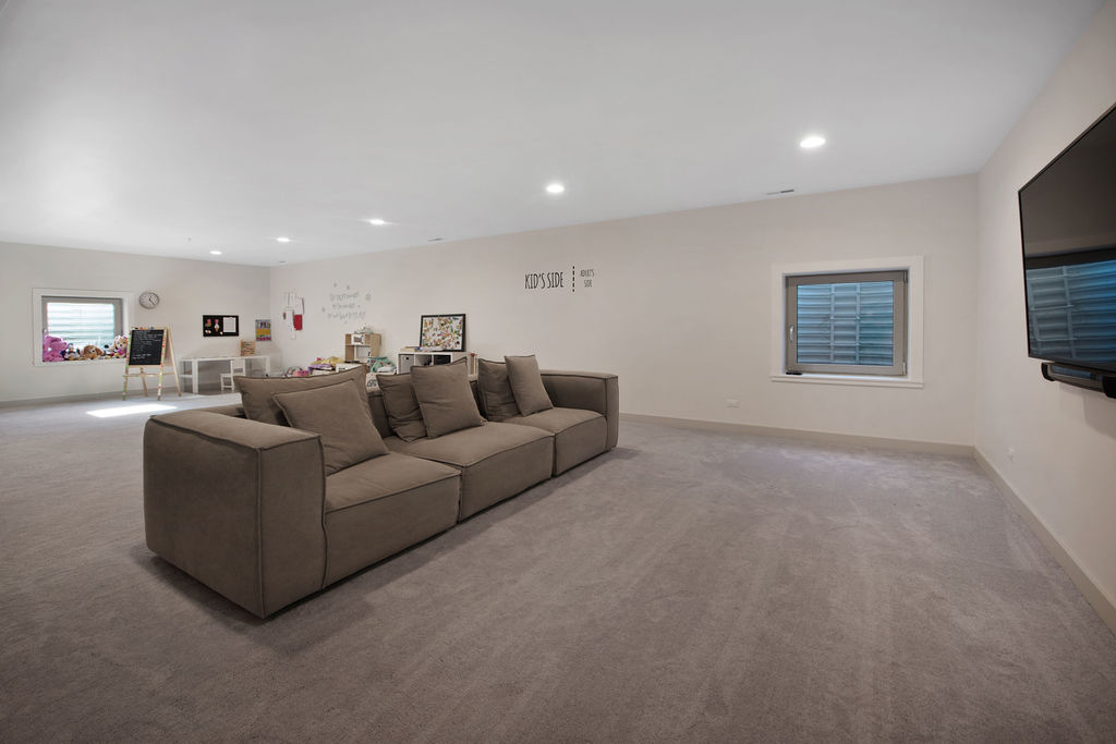 1606 Elliott Street Park Ridge, IL 60068 - Photo 31 of 36 a living room with furniture and a flat screen tv