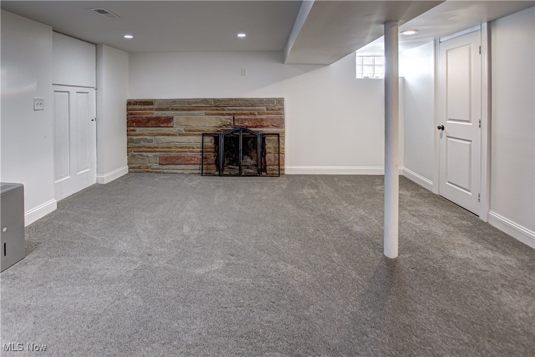 12477 Webster Road Strongsville, OH 44136 - Photo 30 of 40 Basement with carpet and a fireplace