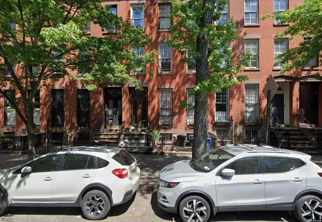 a view of parking with cars parked