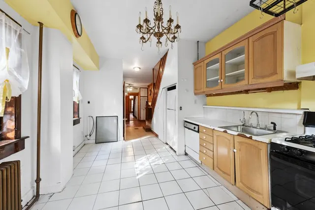 a kitchen with stainless steel appliances a sink and cabinets