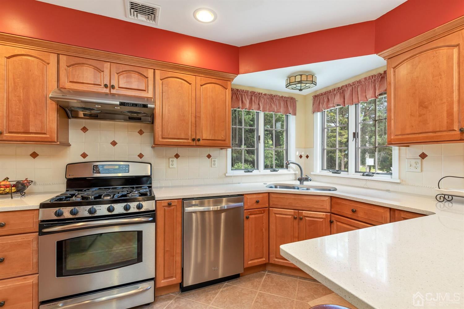 170 Wilson Road Somerset, NJ 08873 - Photo 14 of 57 a kitchen with stainless steel appliances granite countertop a stove and a sink