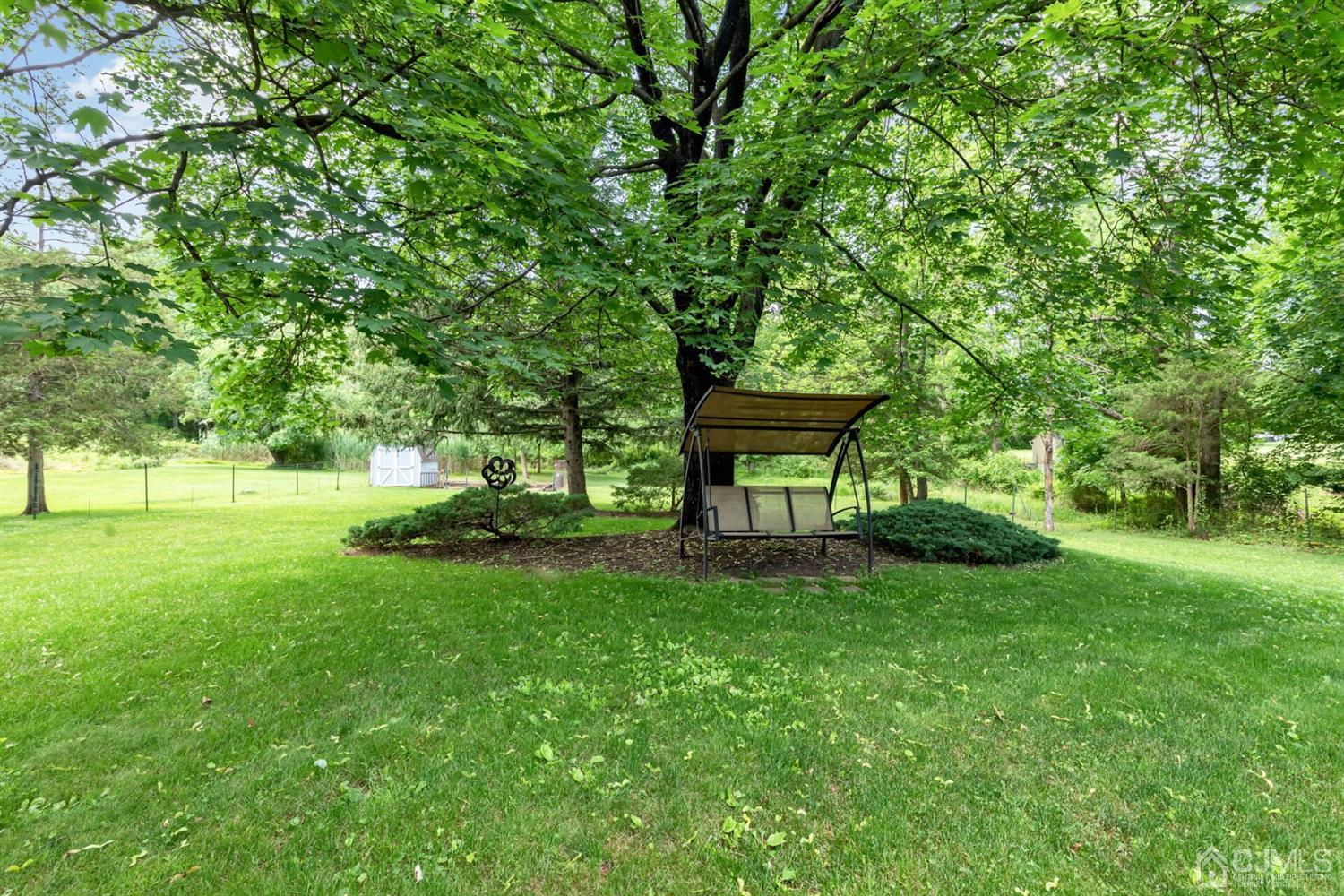 170 Wilson Road Somerset, NJ 08873 - Photo 42 of 57 a view of a garden with a bench