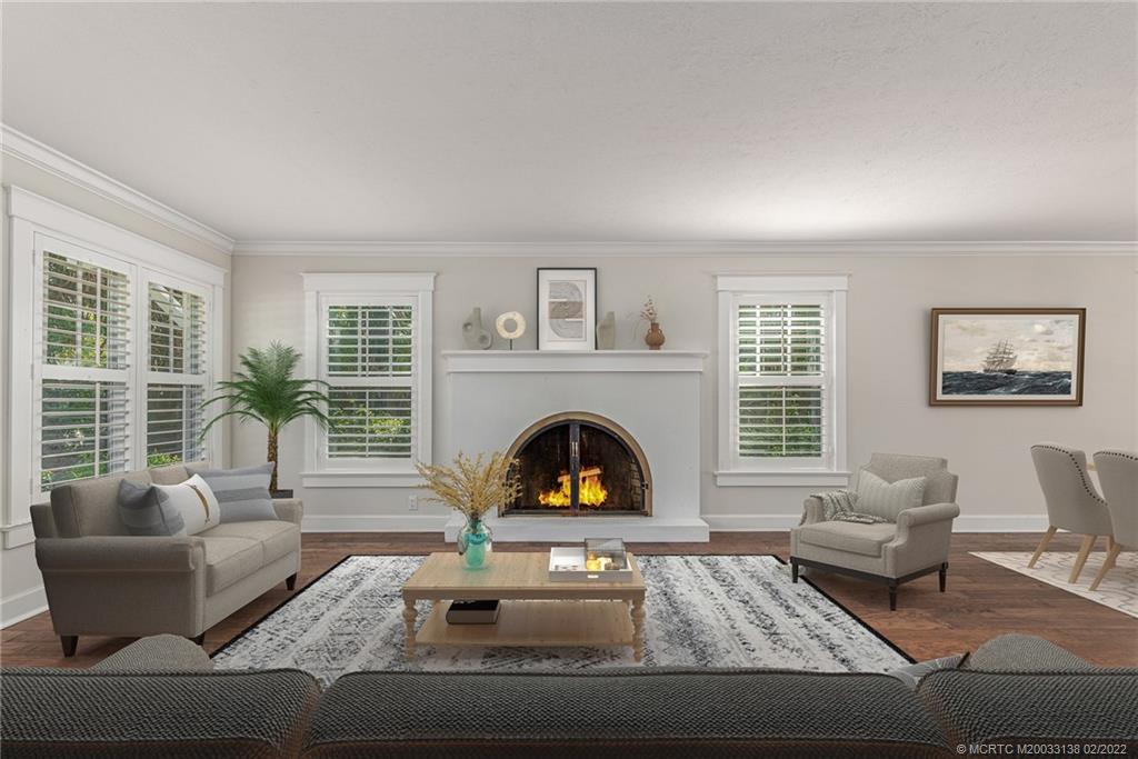 9 Middle Road Stuart, FL 34996 - Photo 3 of 32 a living room with furniture and a fireplace