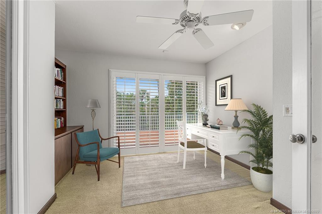 9 Middle Road Stuart, FL 34996 - Photo 7 of 32 a living room with furniture and a potted plant