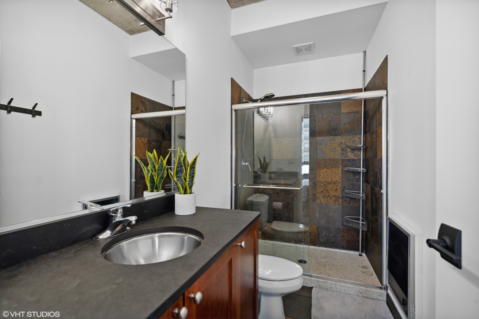 321 South Sangamon Street, Unit 810 Chicago, IL 60607 - Photo 11 of 14 a bathroom with a granite countertop sink toilet and shower
