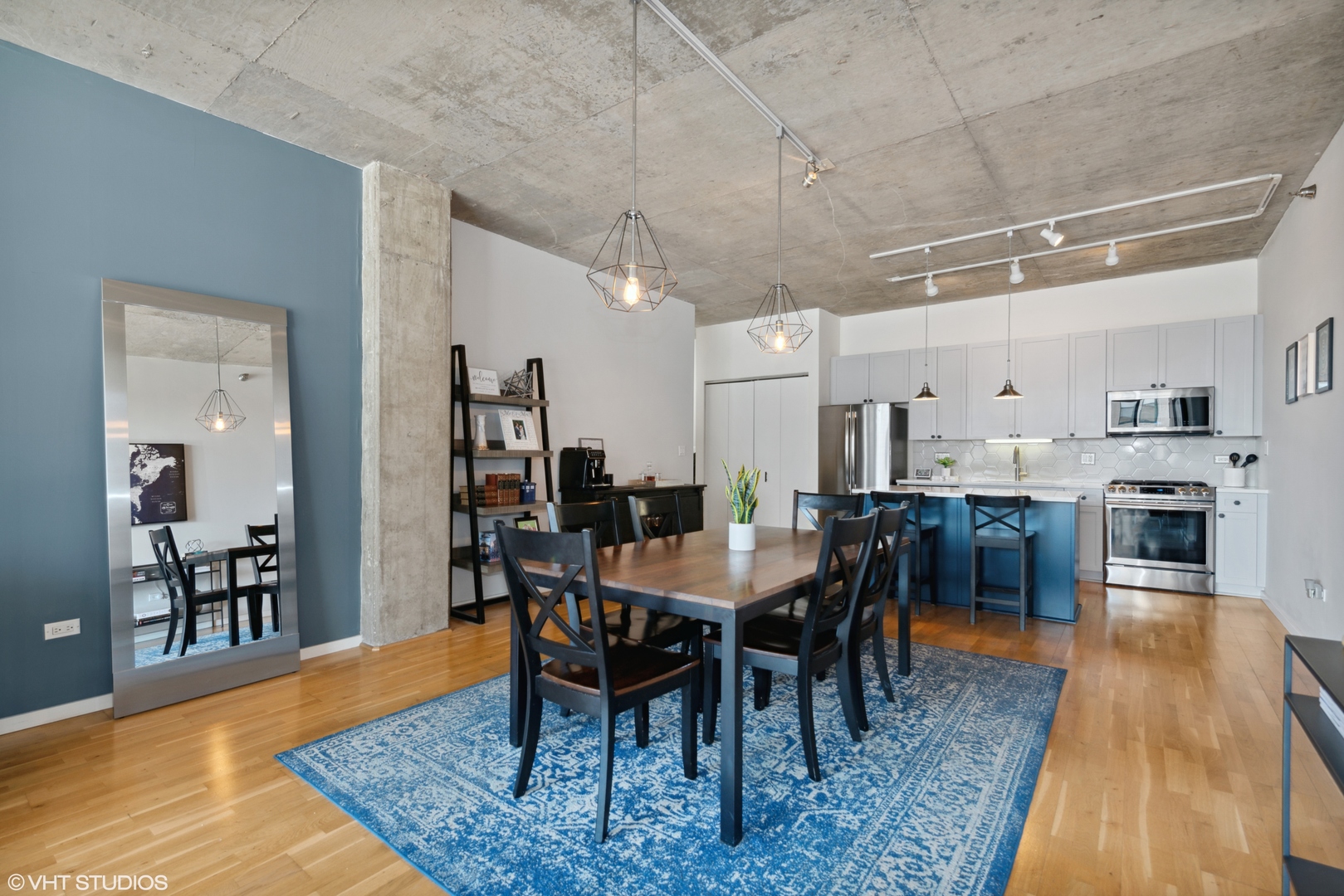 321 South Sangamon Street, Unit 810 Chicago, IL 60607 - Photo 6 of 14 a dining hall with stainless steel appliances granite countertop a dining table and chairs with wooden floor