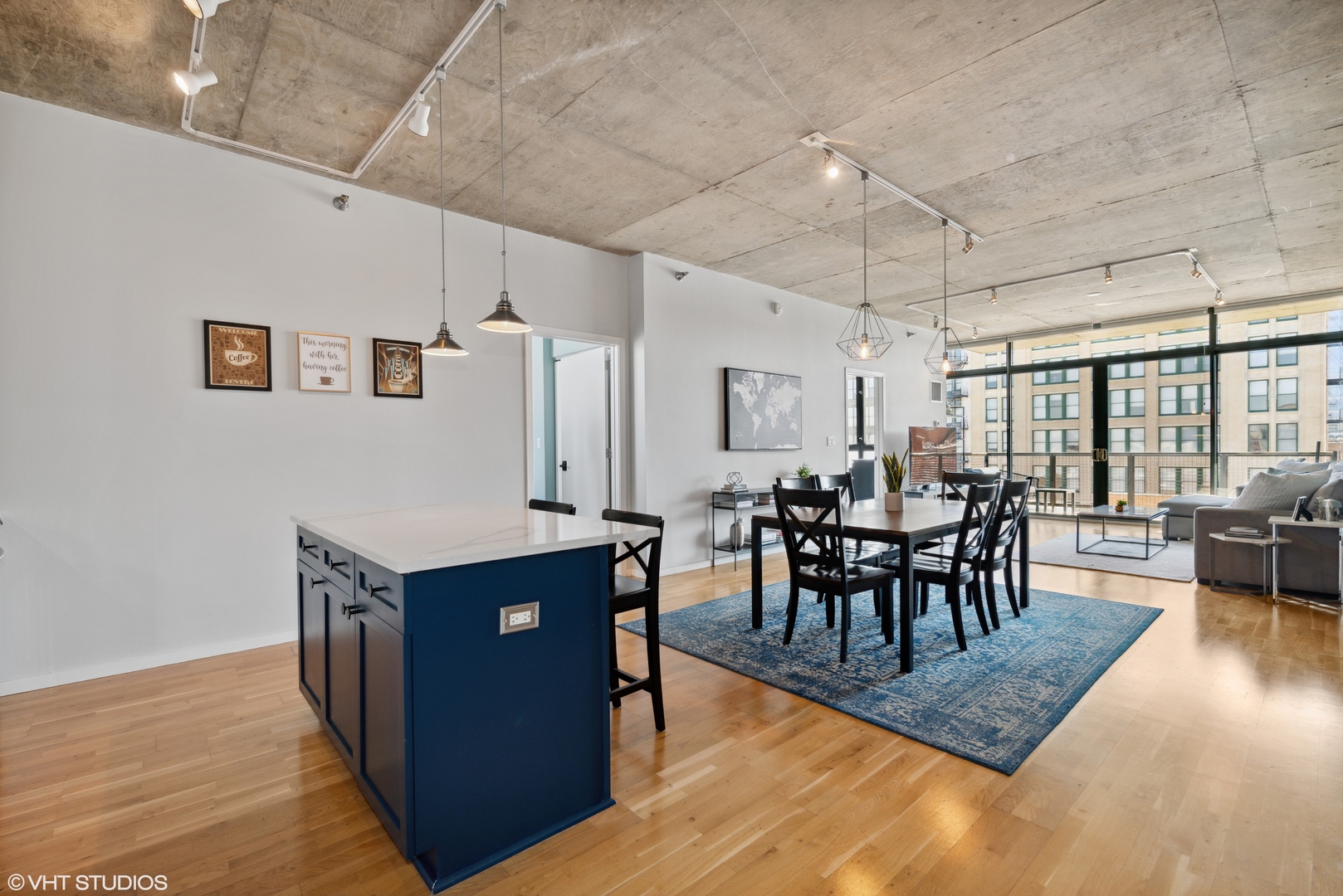 321 South Sangamon Street, Unit 810 Chicago, IL 60607 - Photo 7 of 14 a view of a dining room with furniture and wooden floor
