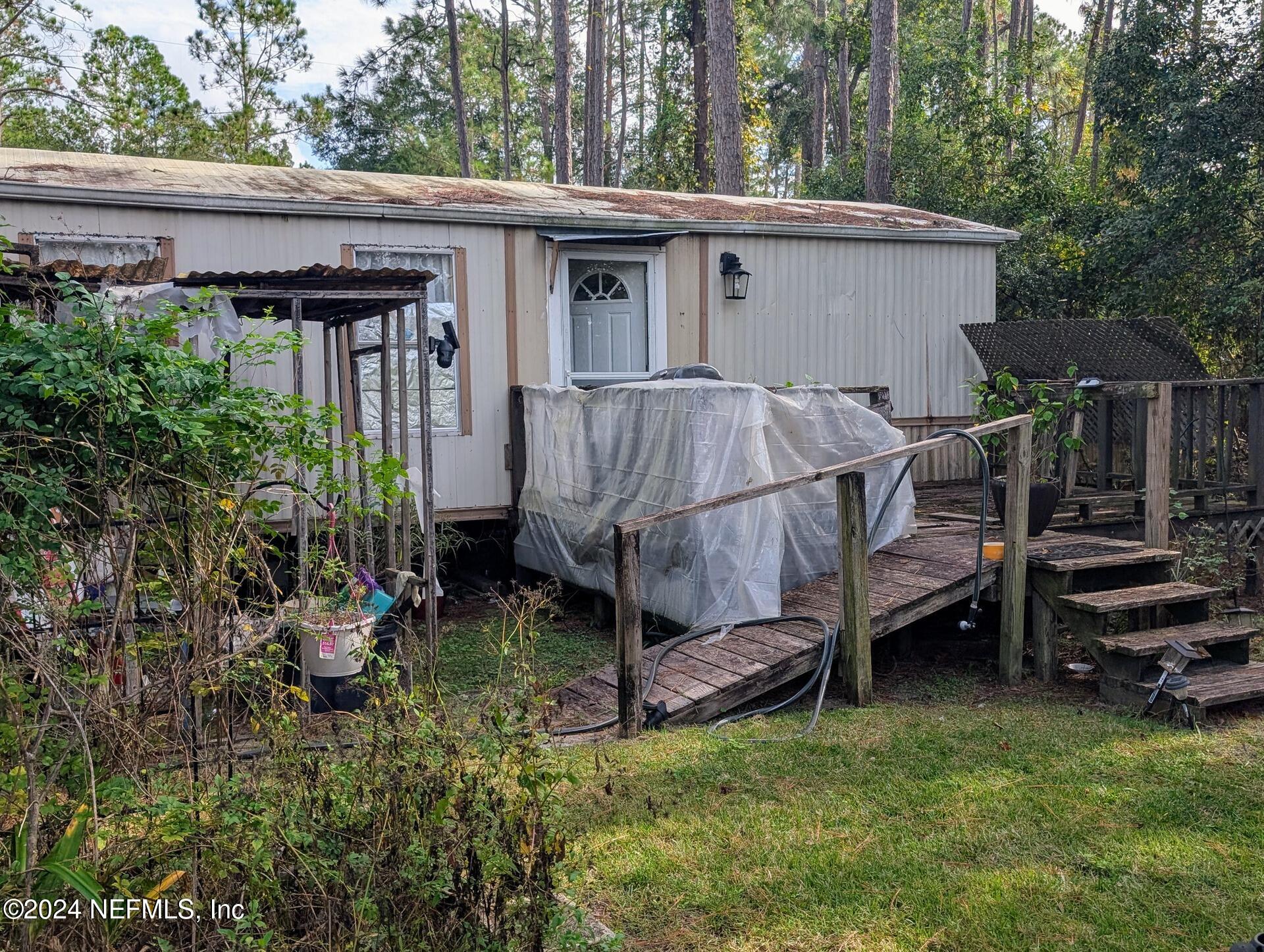 133 Mullis Avenue Interlachen, FL 32148 - Photo 16 of 45 Mobile Home With Wooden Ramp