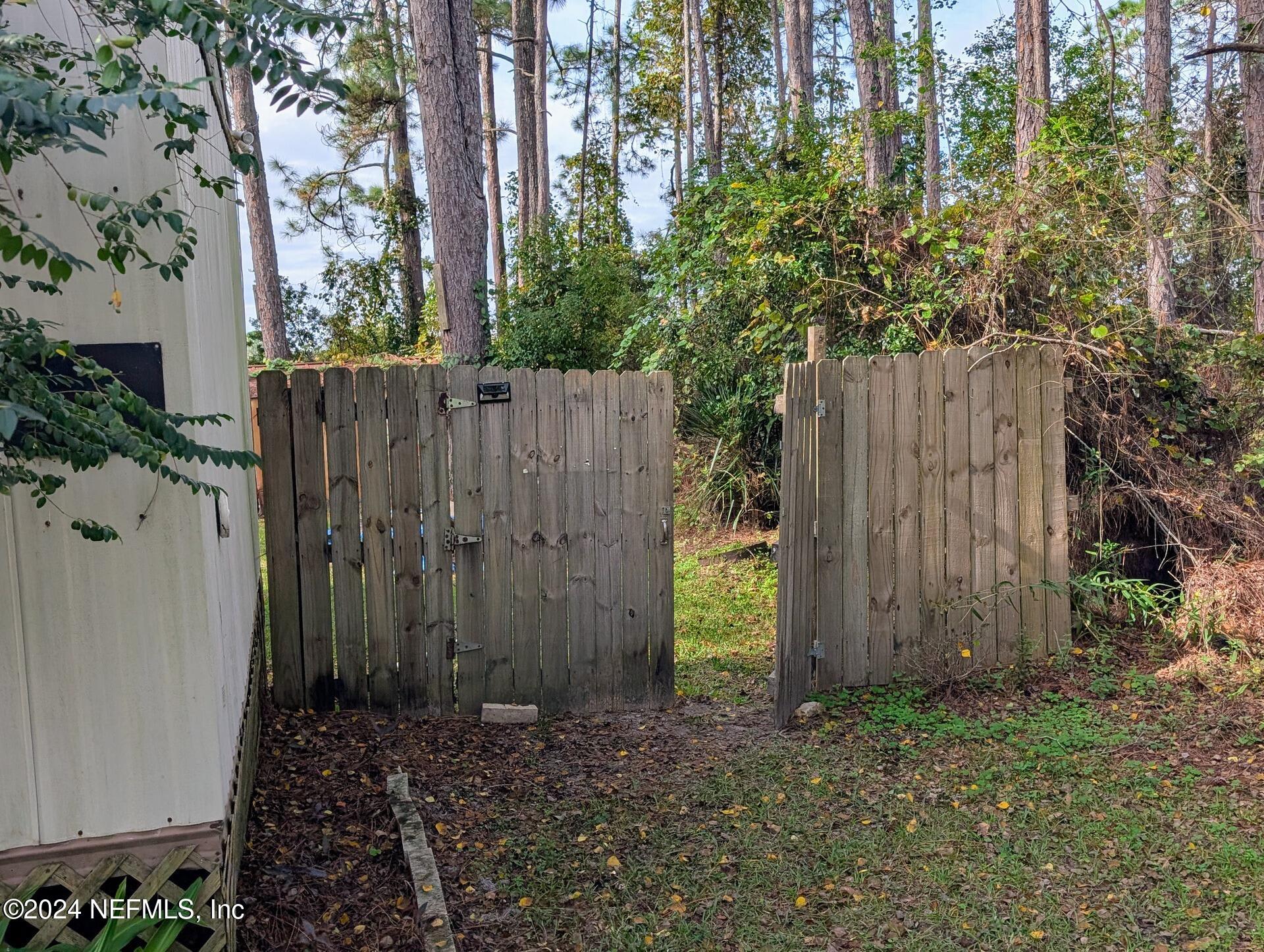 133 Mullis Avenue Interlachen, FL 32148 - Photo 34 of 45 Wooden Fence Gate in Forest