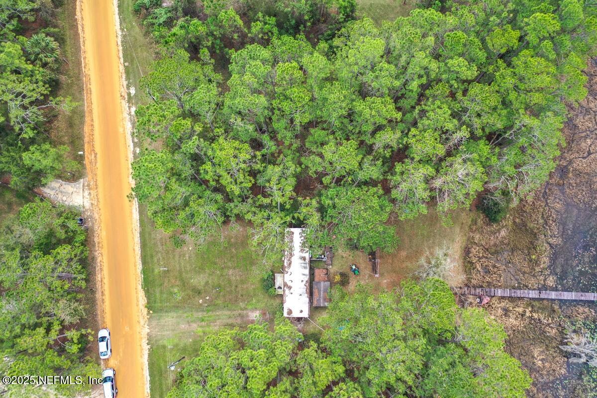133 Mullis Avenue Interlachen, FL 32148 - Photo 9 of 45 Aerial View Of Forested Area With Road