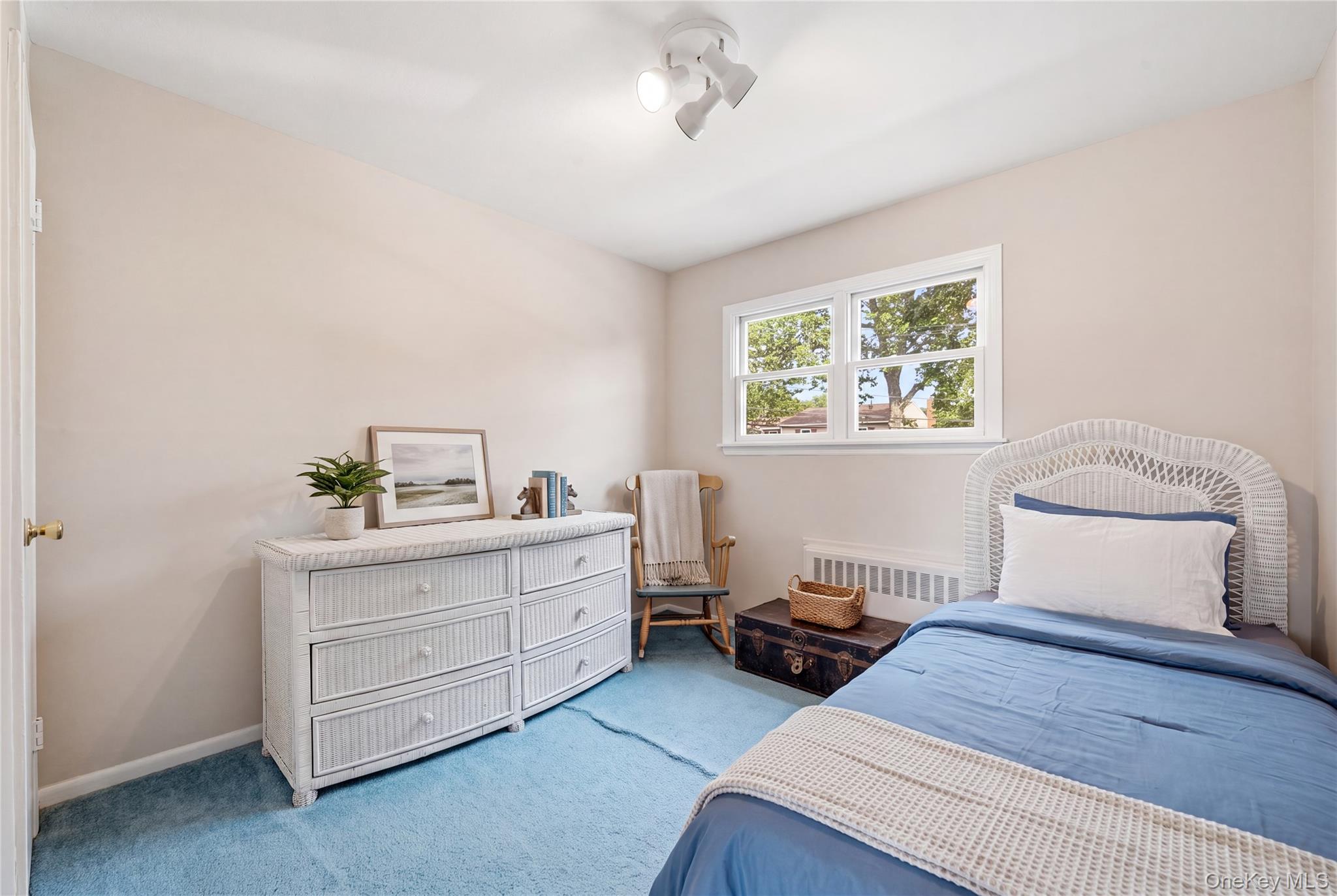 1853 Decatur Avenue Merrick, NY 11566 - Photo 25 of 43 a bedroom with a bed and a window