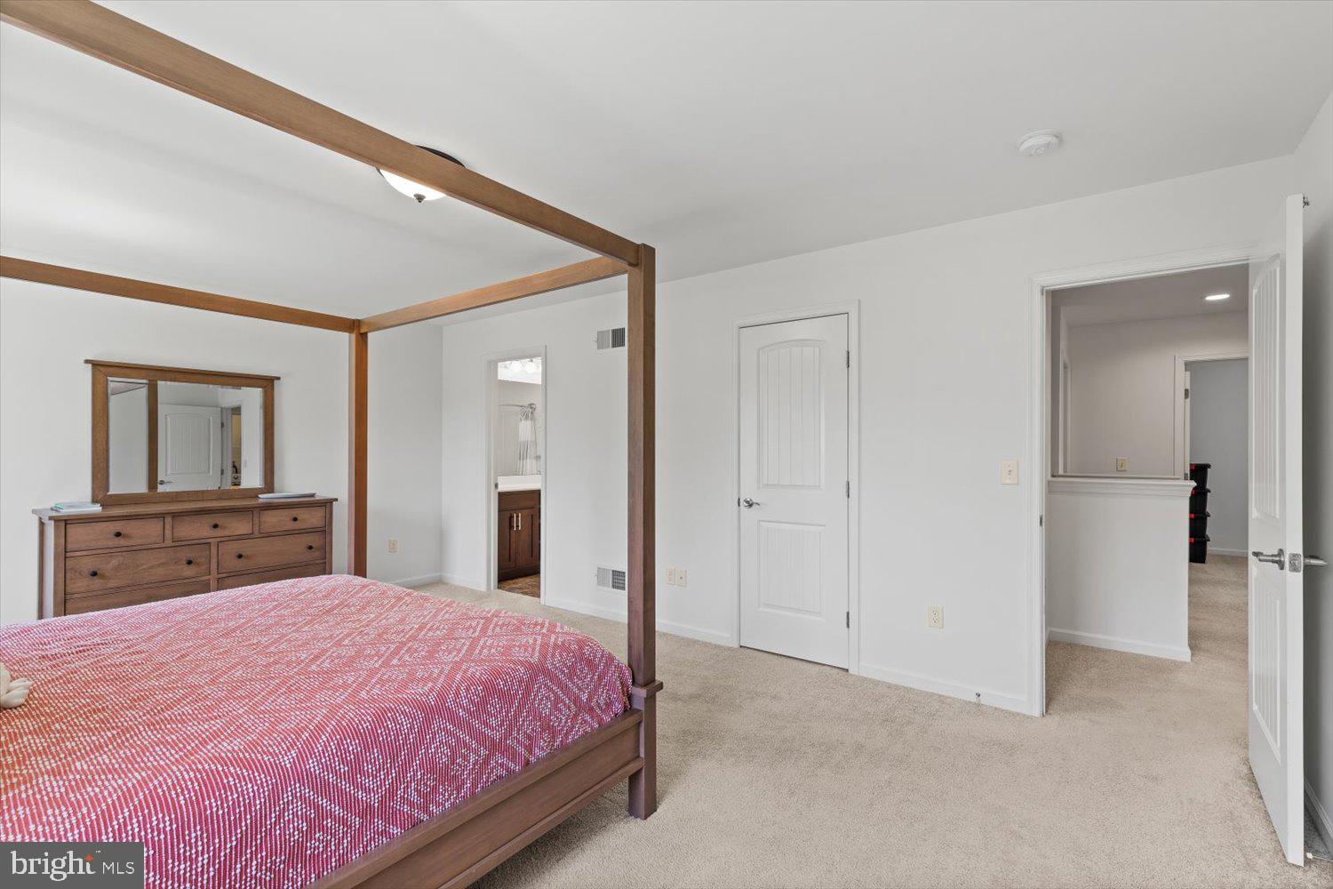 824 Hopeland Road Lititz, PA 17543 - Photo 19 of 46 a bedroom with a large bed and chandelier