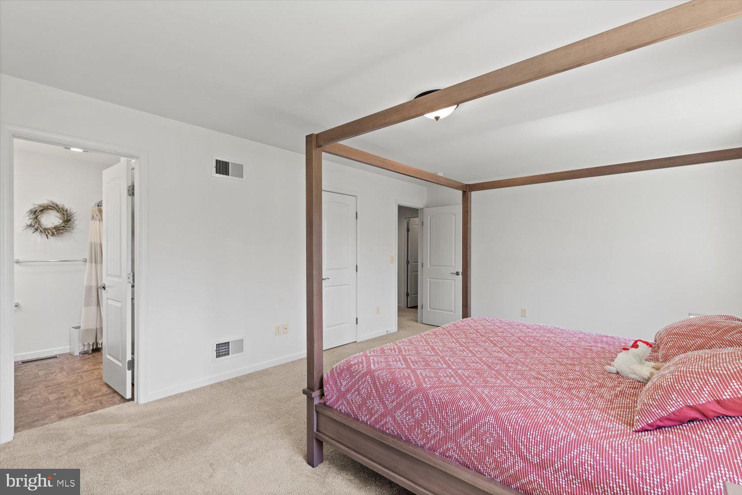 824 Hopeland Road Lititz, PA 17543 - Photo 20 of 46 a bedroom with a bed and a mirror
