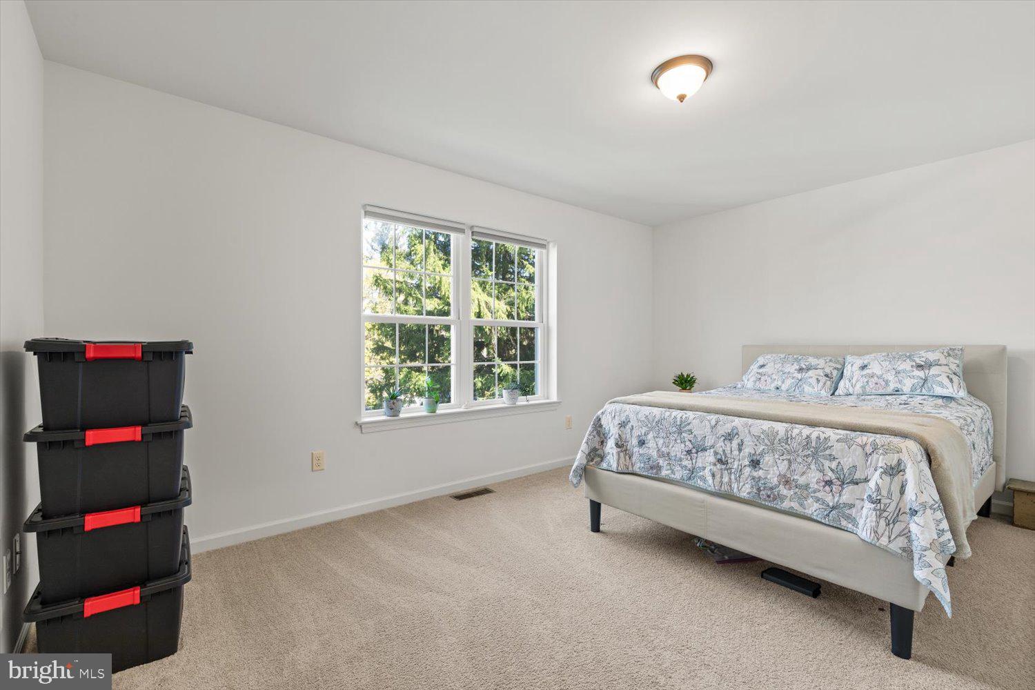 824 Hopeland Road Lititz, PA 17543 - Photo 27 of 46 a bedroom with a bed tv and a window