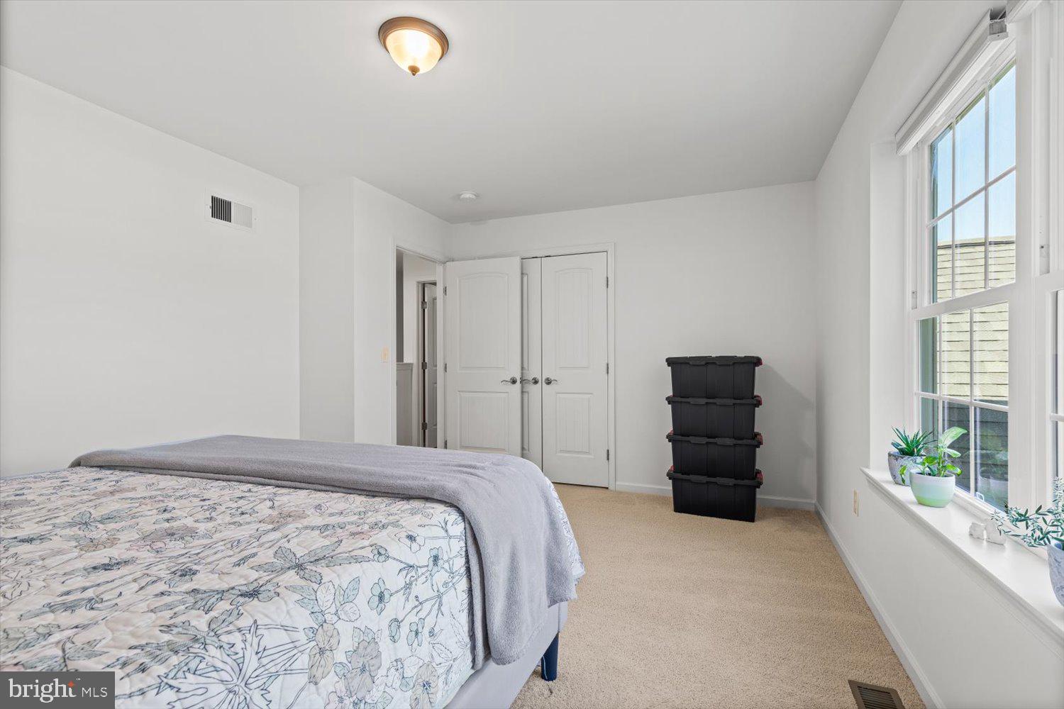 824 Hopeland Road Lititz, PA 17543 - Photo 29 of 46 a spacious bedroom with a bed and a large window