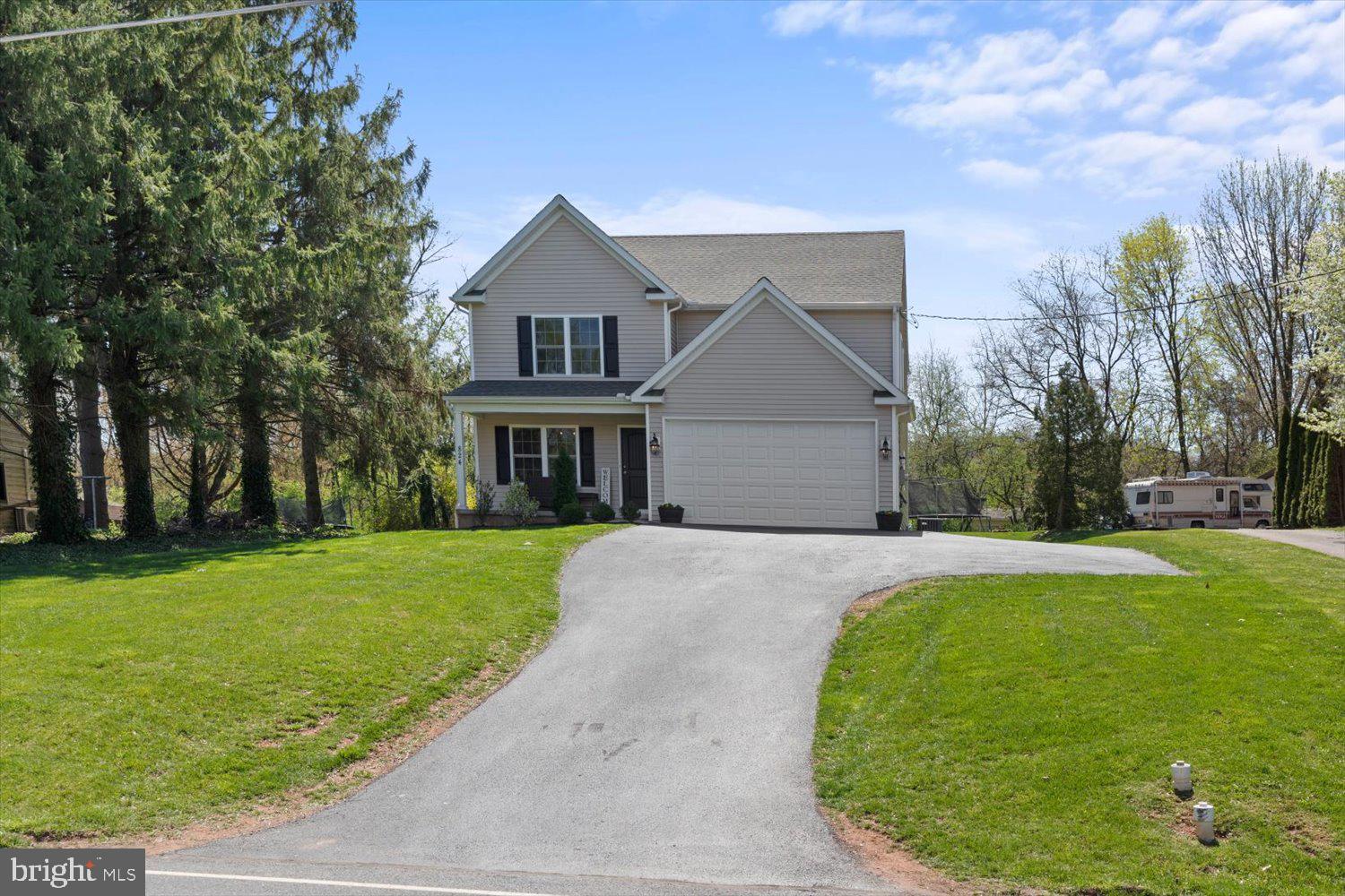 824 Hopeland Road Lititz, PA 17543 - Photo 4 of 46 a front view of a house with garden