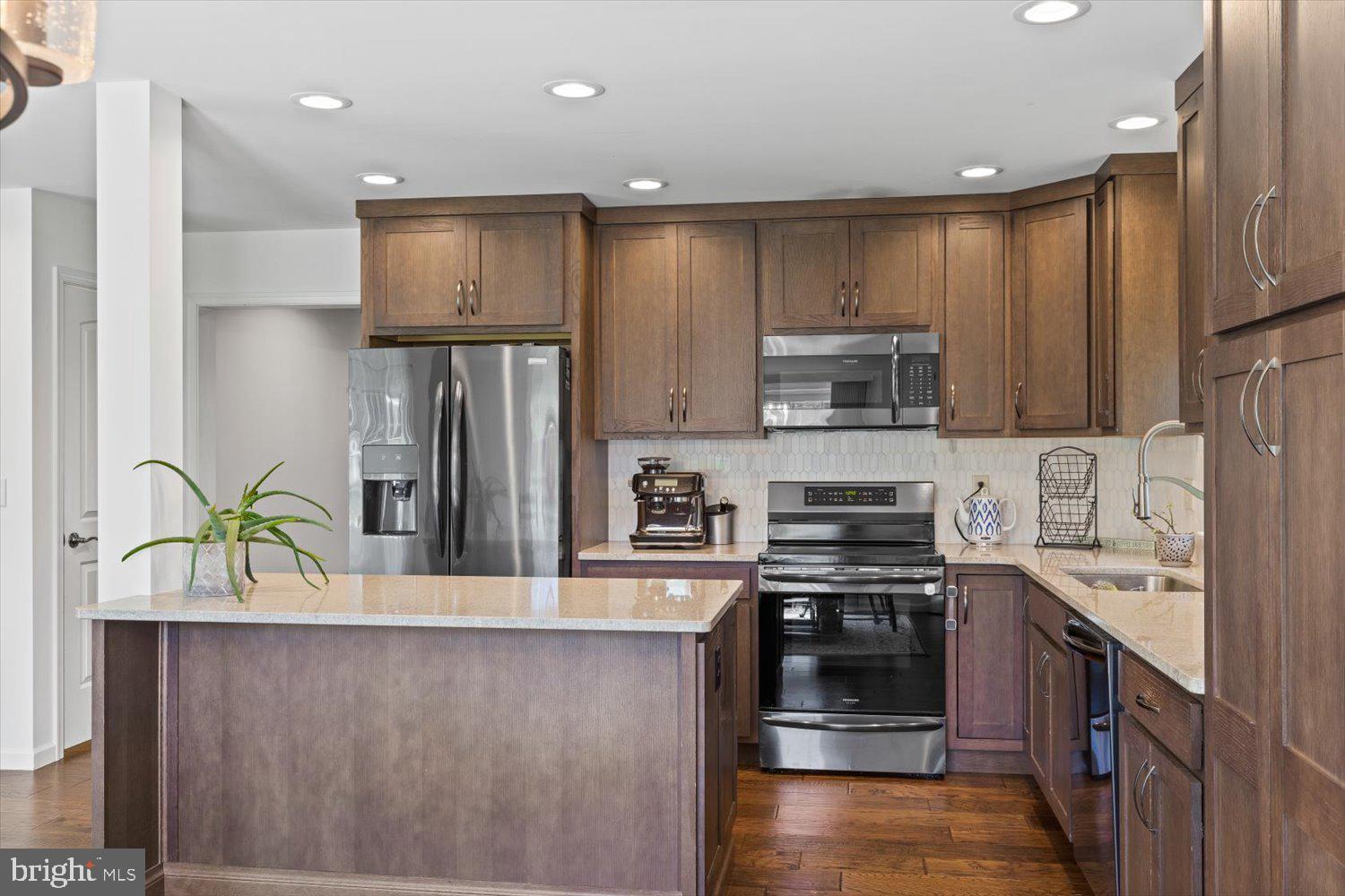 824 Hopeland Road Lititz, PA 17543 - Photo 8 of 46 a kitchen with stainless steel appliances a stove a sink a microwave a refrigerator and cabinets