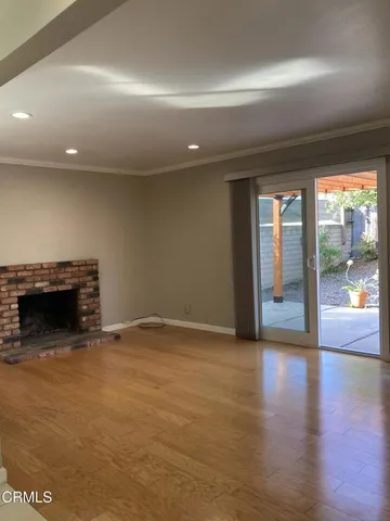 wooden floor with a fireplace in it
