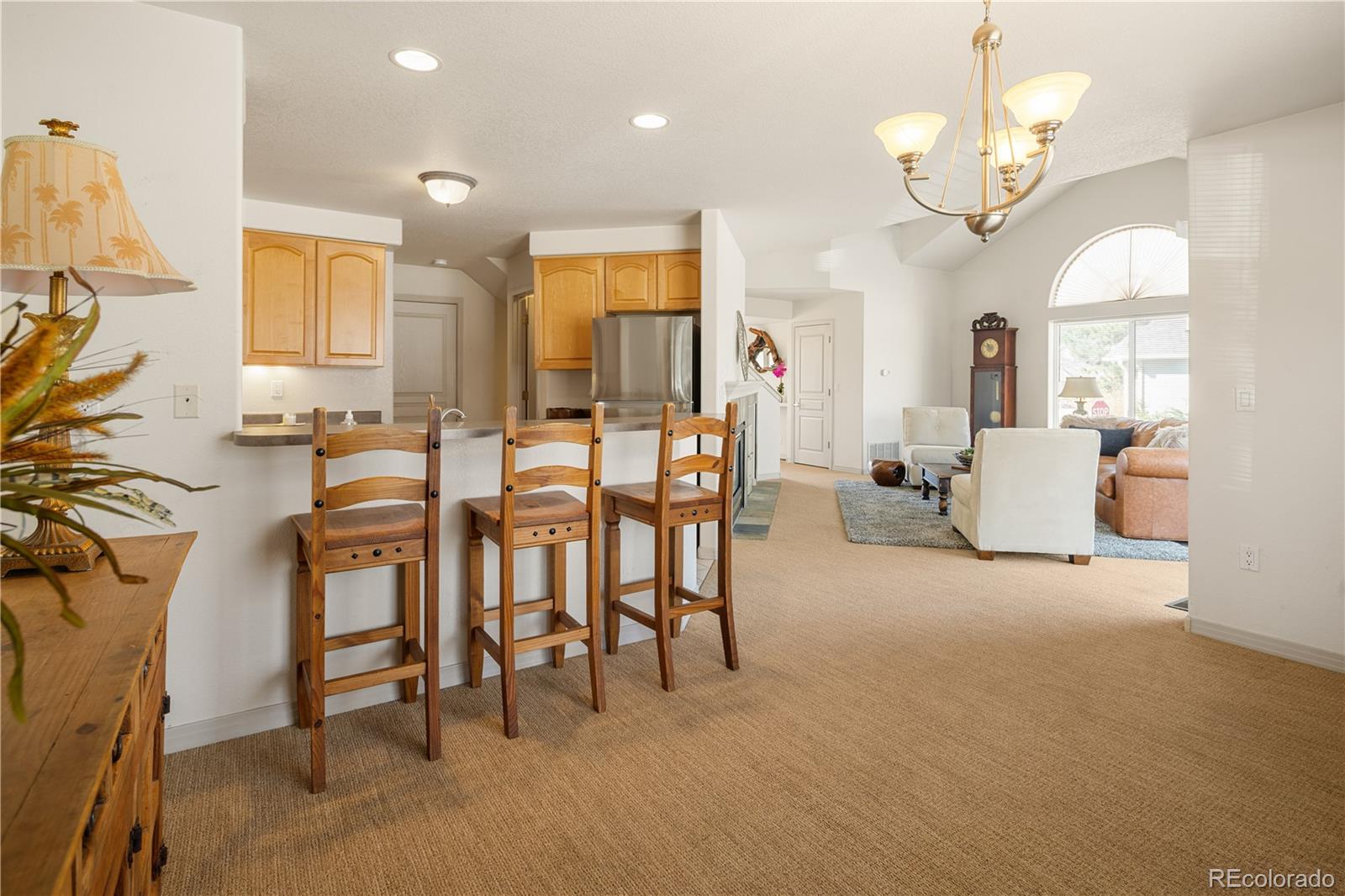 925 Hover Ridge Circle Longmont, CO 80501 - Photo 12 of 35 a view of a dining room with furniture and a chandelier