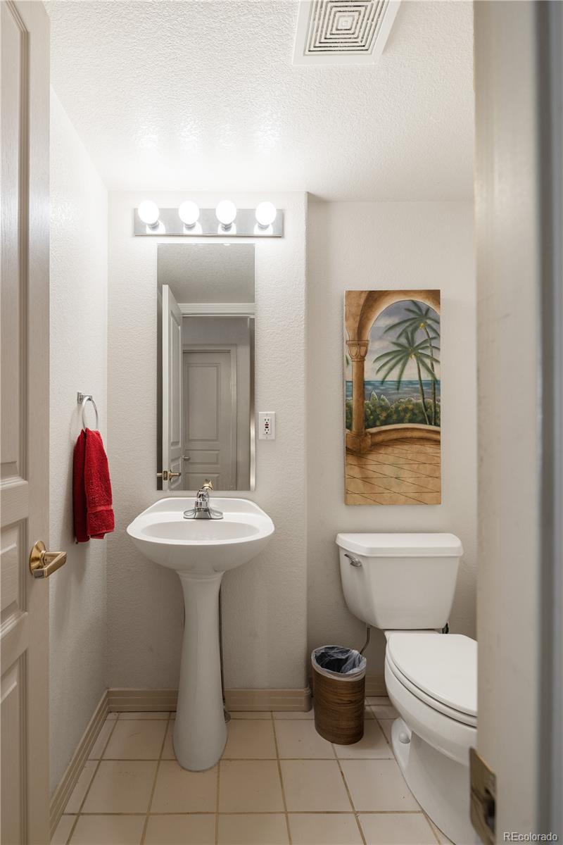 925 Hover Ridge Circle Longmont, CO 80501 - Photo 16 of 35 a bathroom with a toilet sink and mirror