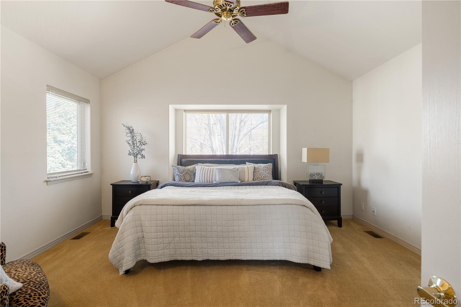 925 Hover Ridge Circle Longmont, CO 80501 - Photo 18 of 35 a bedroom with a bed and window