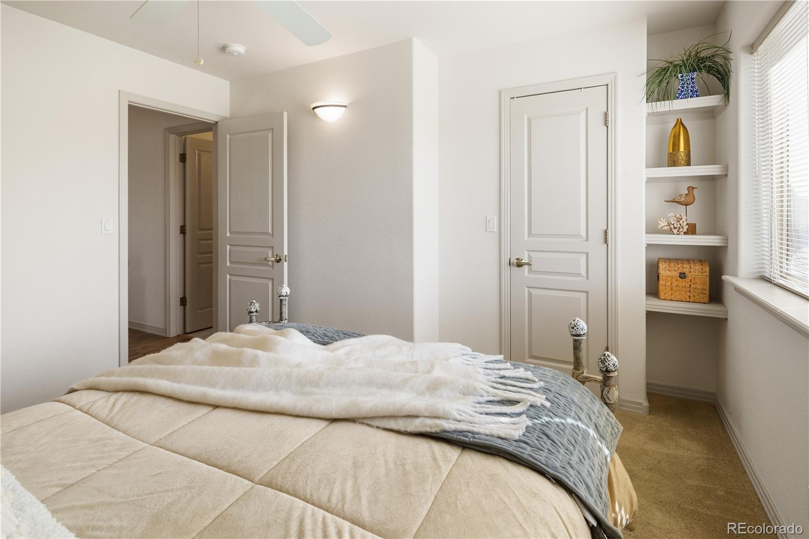 925 Hover Ridge Circle Longmont, CO 80501 - Photo 22 of 35 a bedroom with a bed and closet