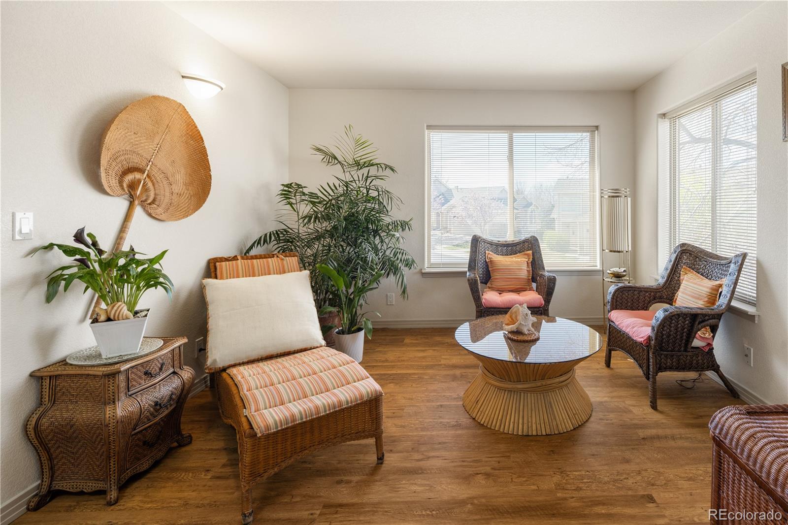 925 Hover Ridge Circle Longmont, CO 80501 - Photo 27 of 35 a living room with furniture and a potted plant