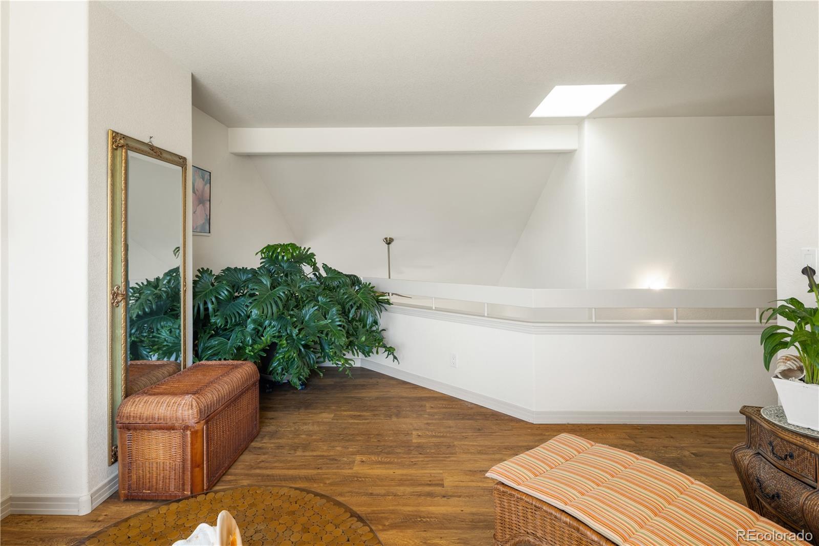 925 Hover Ridge Circle Longmont, CO 80501 - Photo 28 of 35 a living room with furniture and a potted plant
