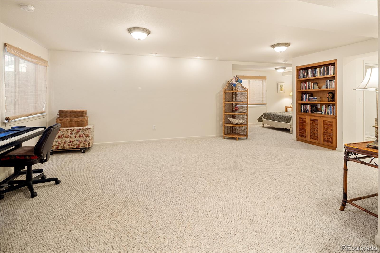 925 Hover Ridge Circle Longmont, CO 80501 - Photo 29 of 35 a view of a livingroom with workspace and a window