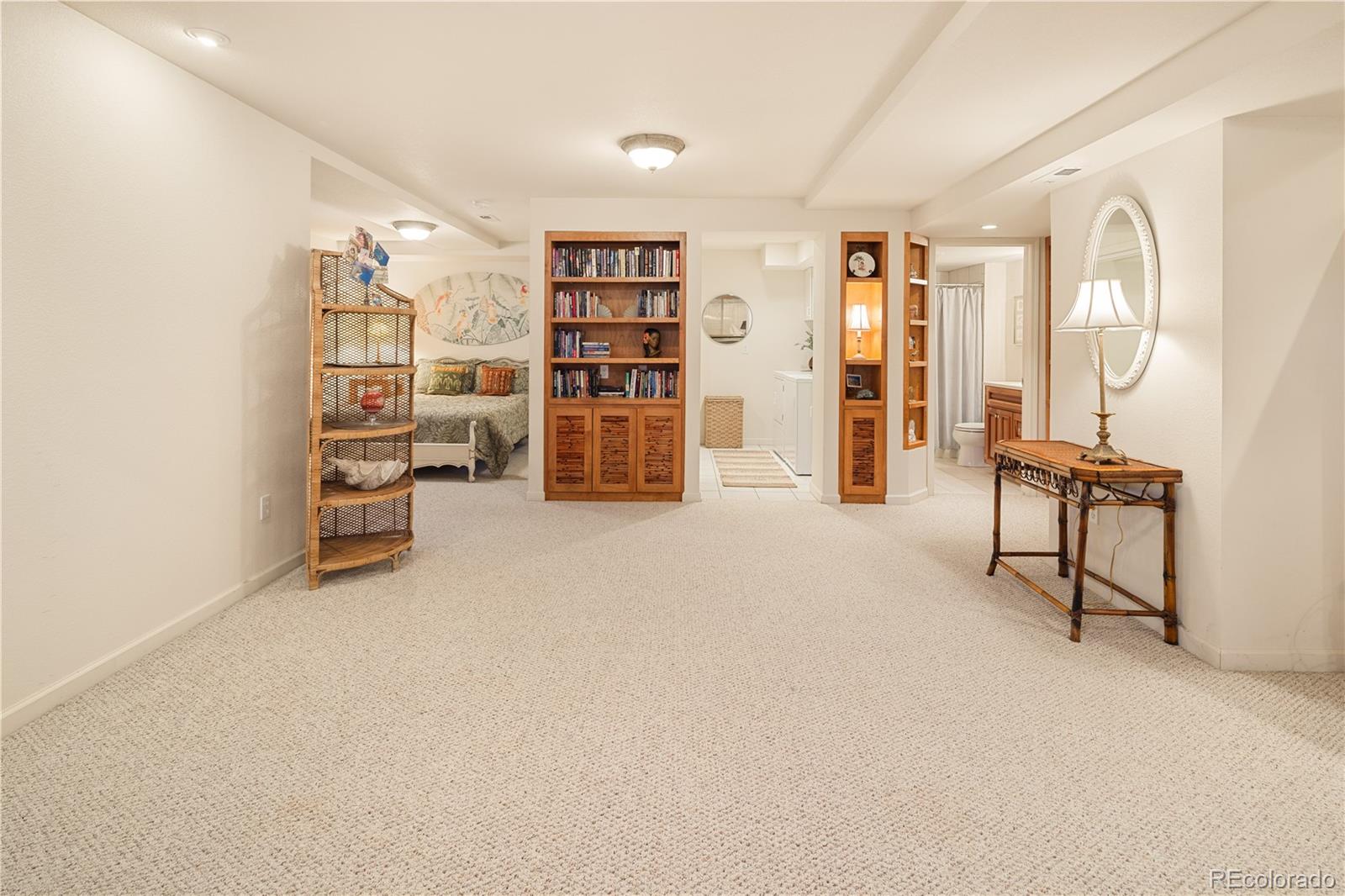 925 Hover Ridge Circle Longmont, CO 80501 - Photo 30 of 35 an empty room with bookshelf and a large window