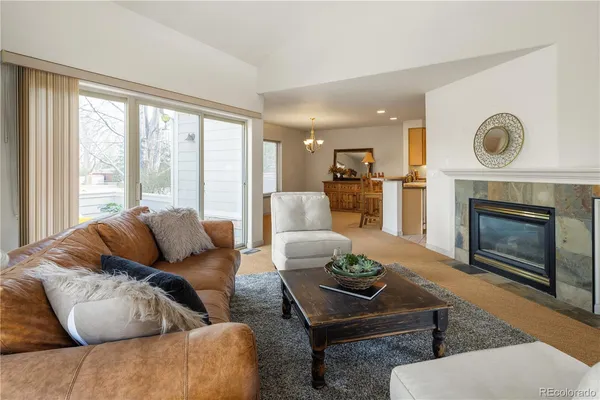 a living room with furniture couches and a fireplace