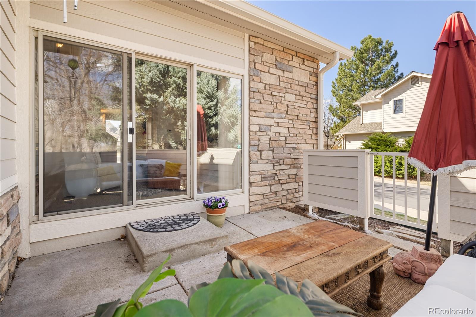 925 Hover Ridge Circle Longmont, CO 80501 - Photo 10 of 35 a backyard of a house with table and chairs