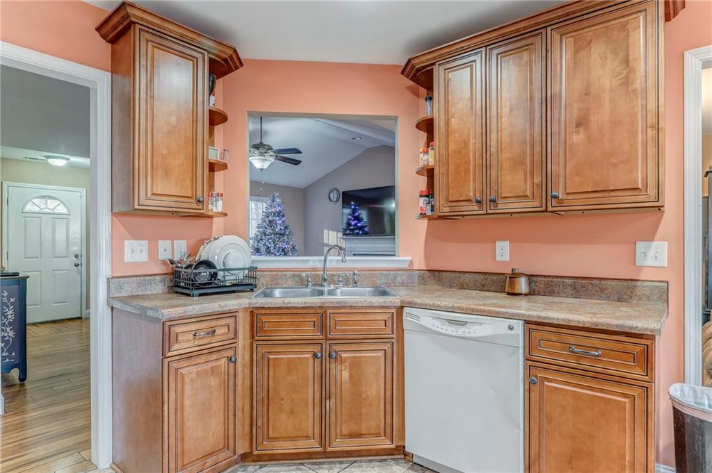 1040 Old Dalton Road Northeast Rome, GA 30165 - Photo 13 of 20 a kitchen with stainless steel appliances granite countertop a sink and cabinets