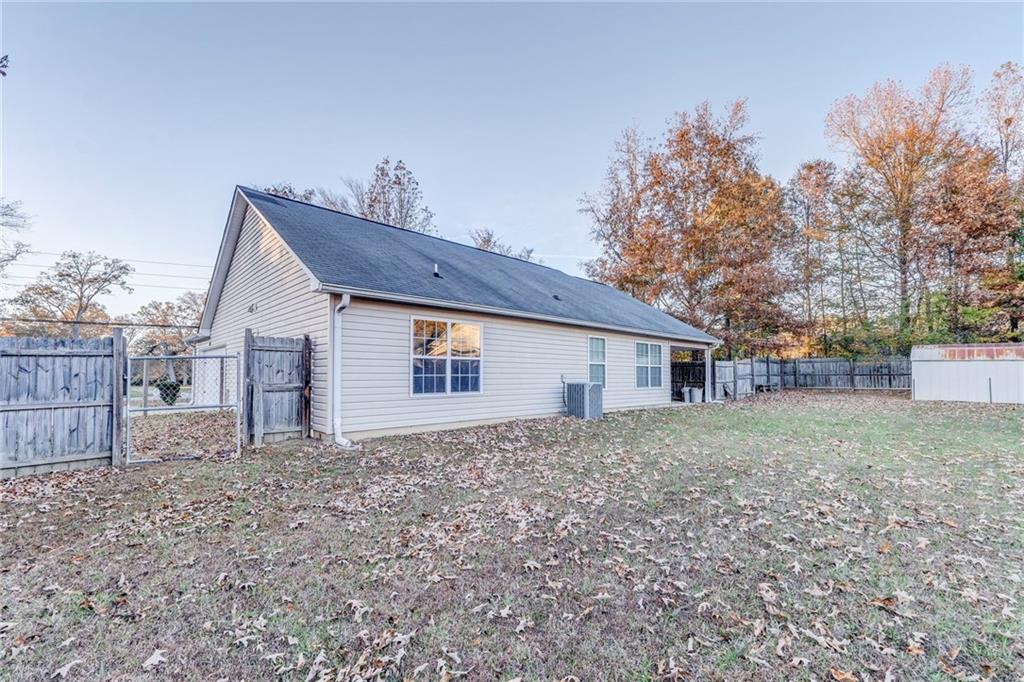 1040 Old Dalton Road Northeast Rome, GA 30165 - Photo 18 of 20 a view of a house with a yard and large tree