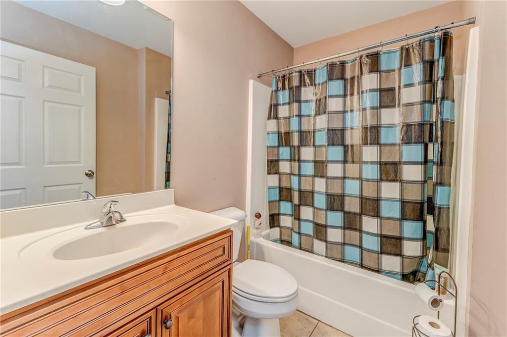 1040 Old Dalton Road Northeast Rome, GA 30165 - Photo 5 of 20 a bathroom with a sink toilet and shower
